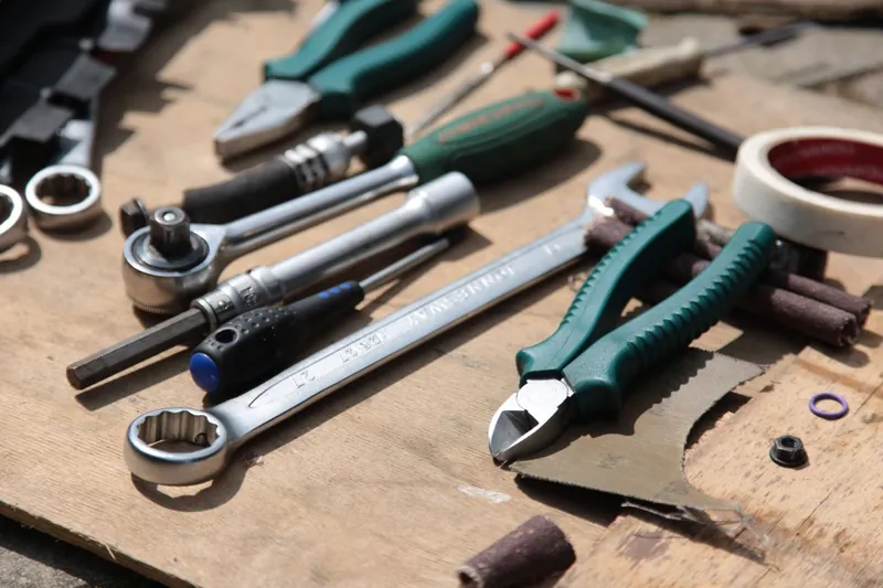 Electrician's tool belt with pliers, screwdrivers, and wire strippers